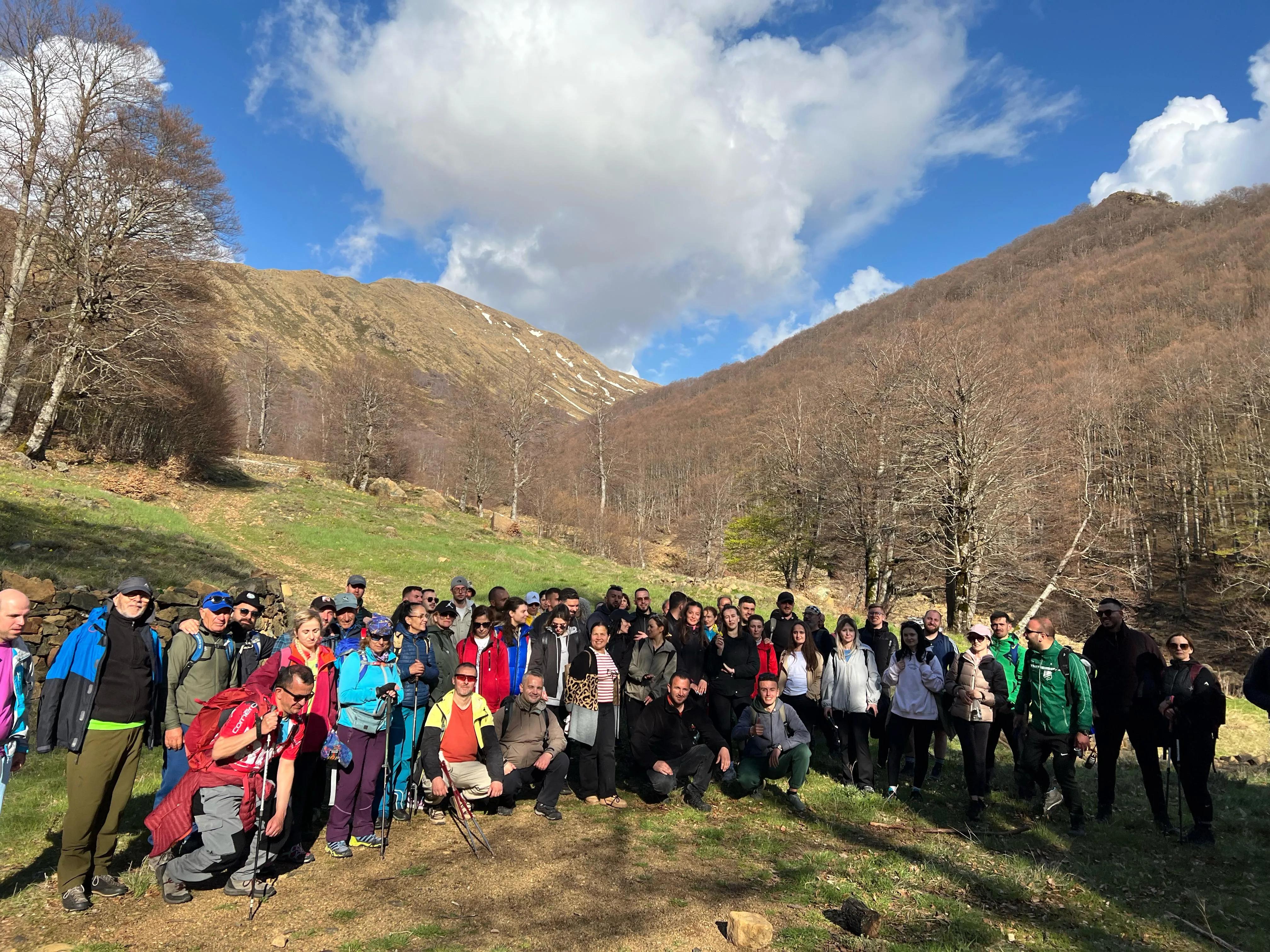 Hikers group photo in a beech forest