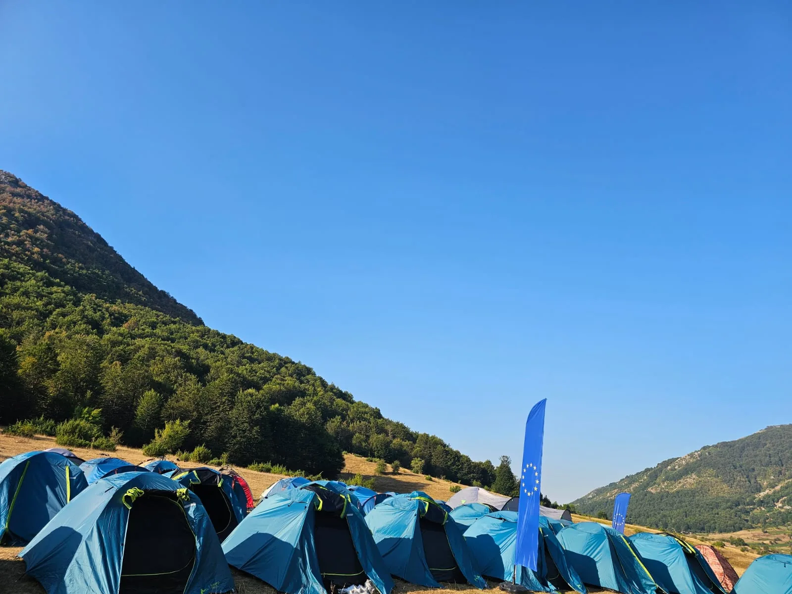 Row of tents under flags